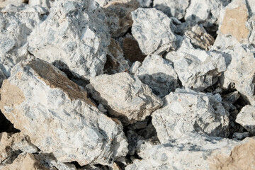 Large concrete stones. Construction waste after dismantling the old building. Close-up