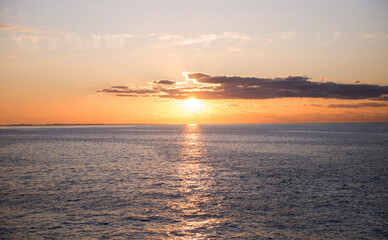 Expanse of the sea against the sunset sky. Beautiful seascape.