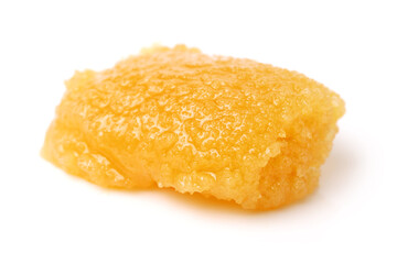 naturally crystallized rape honey on white wooden