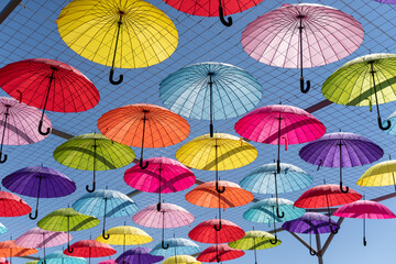 Fototapeta na wymiar colorful umbrellas as a sunshade, colorful background of umbrellas of different colors