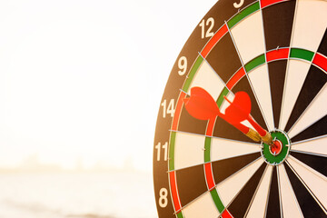 Closeup the dart arrow hit center on Bullseye(bull's-eye) of a dartboard is a target of challenge...