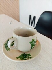 Porcelain cup on a wooden table