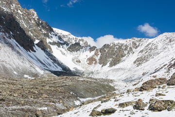 Mountain landscape view in Kyrgyzstan. Rocks, snow and stones in mountain valley view. Mountain...