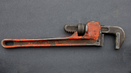 A Red Rusty Pipe Wrench