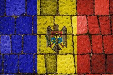 National flag of Moldova on stone  wall background. Flag  banner on  stone texture background.