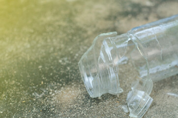 The broken jar fell on the cement floor.