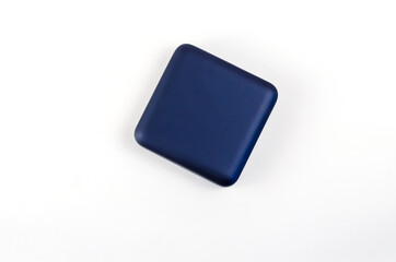 Small Square plastic gift box on white background. Closed blue b