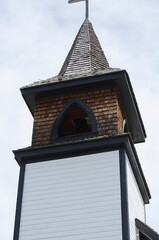 Old Wooden Steeple against Cloudy Sky