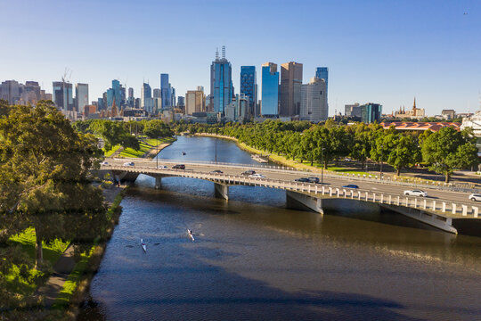 Aerial view of traffic crossing a bridge over an inner city river