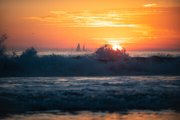 Calm sea with sunset sky and sun through the clouds over. Ocean and sky background, seascape.