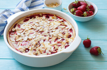 Homemade rustic strawberry cake on blue  wooden table