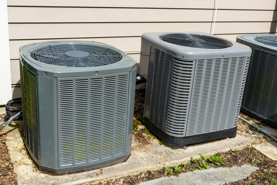 Home air conditioning units installed outside residential home