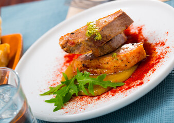 Delicious poultry dish - tender duck fillet with sauces, paprika and arugula