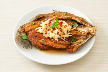 Fried Sea Bass Fish with Fish Sauce and Spicy Salad