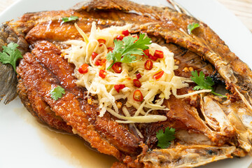 Fried Sea Bass Fish with Fish Sauce and Spicy Salad