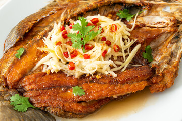 Fried Sea Bass Fish with Fish Sauce and Spicy Salad
