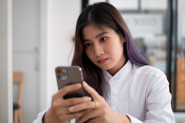 A businesswoman completes KYC using an online banking program in order to open a digital savings account. The definition of cyber security.