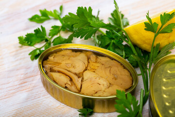 Open tin can of tuna in oil in aluminium can