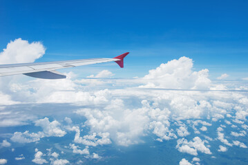 Fototapeta na wymiar Wing of an airplane flying in the sky