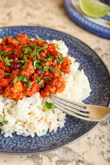 Plate with tasty chili con carne and rice on color background, closeup