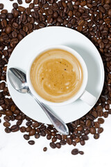 espresso cup on coffee beans