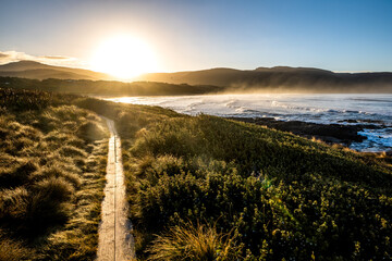 walking path beside the beach at sunrise