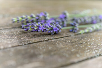 Bouquet of lavender on a wooden garden table.