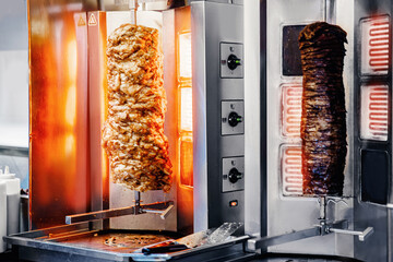 Fresh Turkish shawarma kebab, meat cooked on an electric skewer.