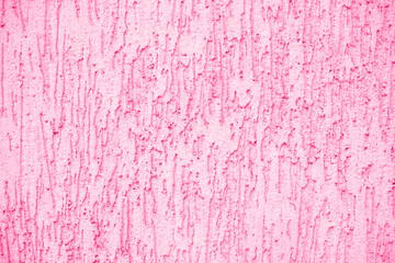 Concrete pink wall background on the street.