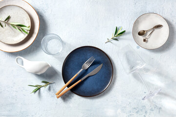 Modern ceramic tableware, overhead flat lay shot with olive branches. Mediterranean cuisine...