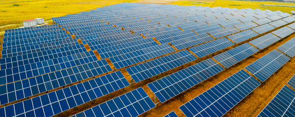 Aerial photography of solar photovoltaic cell panels illuminated by the sunset