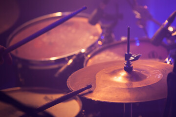Fototapeta na wymiar Drum set in stage lights. Close-up photo