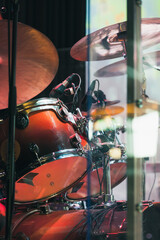 Drum set in colorful stage lights, close-up photo