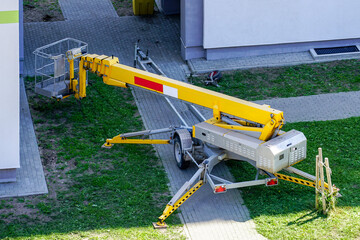 a modern mobile self propelled hydraulic lifting platform brought to the site