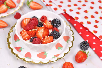 Berry mix yogurt bowl with strawberry, raspberry and blackberry fruits and puffed quinoa
