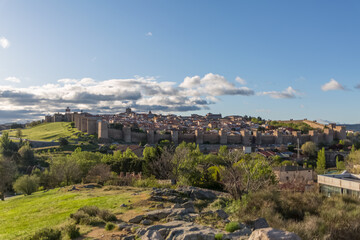 Fototapeta na wymiar Majestic panoramic view of Ávila city Walls & fortress, full around view at the medieval historic city