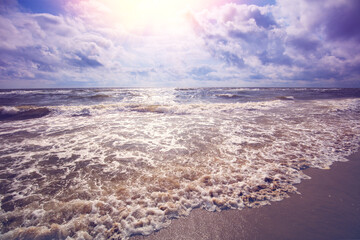 Early morning. Sunrise over the stormy sea