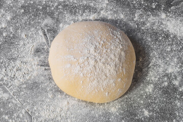  Dough makes fresh bread on the kitchen table.