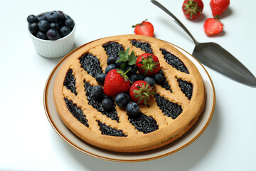 Concept of delicious food with blueberry pie on white background