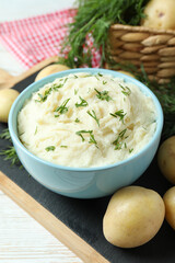 Concept of tasty eating with mashed potatoes on white wooden table
