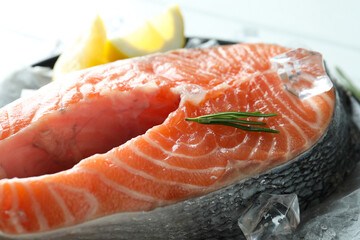 Fresh raw salmon and ingredients for cooking, close up