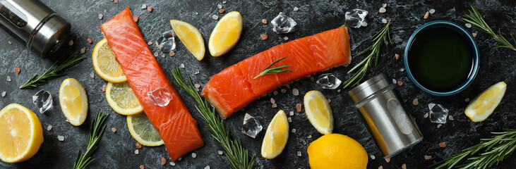 Concept of cooking salmon on black smokey background