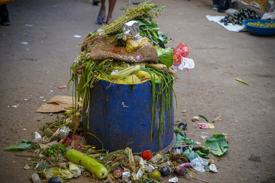 Closeup Shot Of An Overflowing Trash Can At A Market