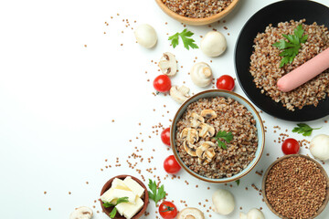 Concept of tasty eating with buckwheat on white background