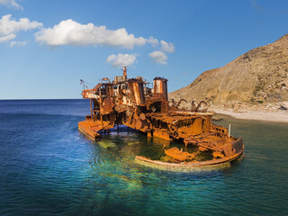 Naklejka premium Rusty iron wreck of a ship on the coast of the Greek island of Limnos in the North Aegean
