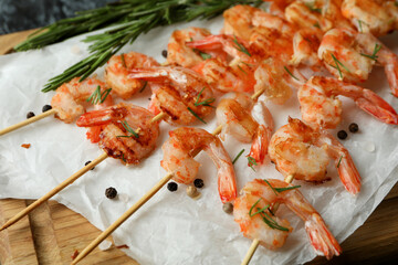 Concept of tasty eating with grilled shrimps, close up