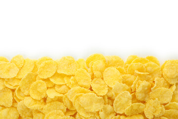 Dry uncooked corn flakes isolated on white background