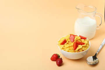 Concept of tasty breakfast with cornflakes on beige background
