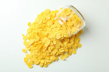 Jar of corn flakes on white background