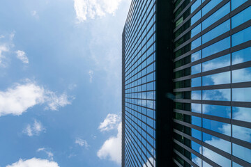 Business building. Modern office business building with glass, steel facade exterior. Finance corporate architecture city in abstract blue sky with nature cloud in sunny day.